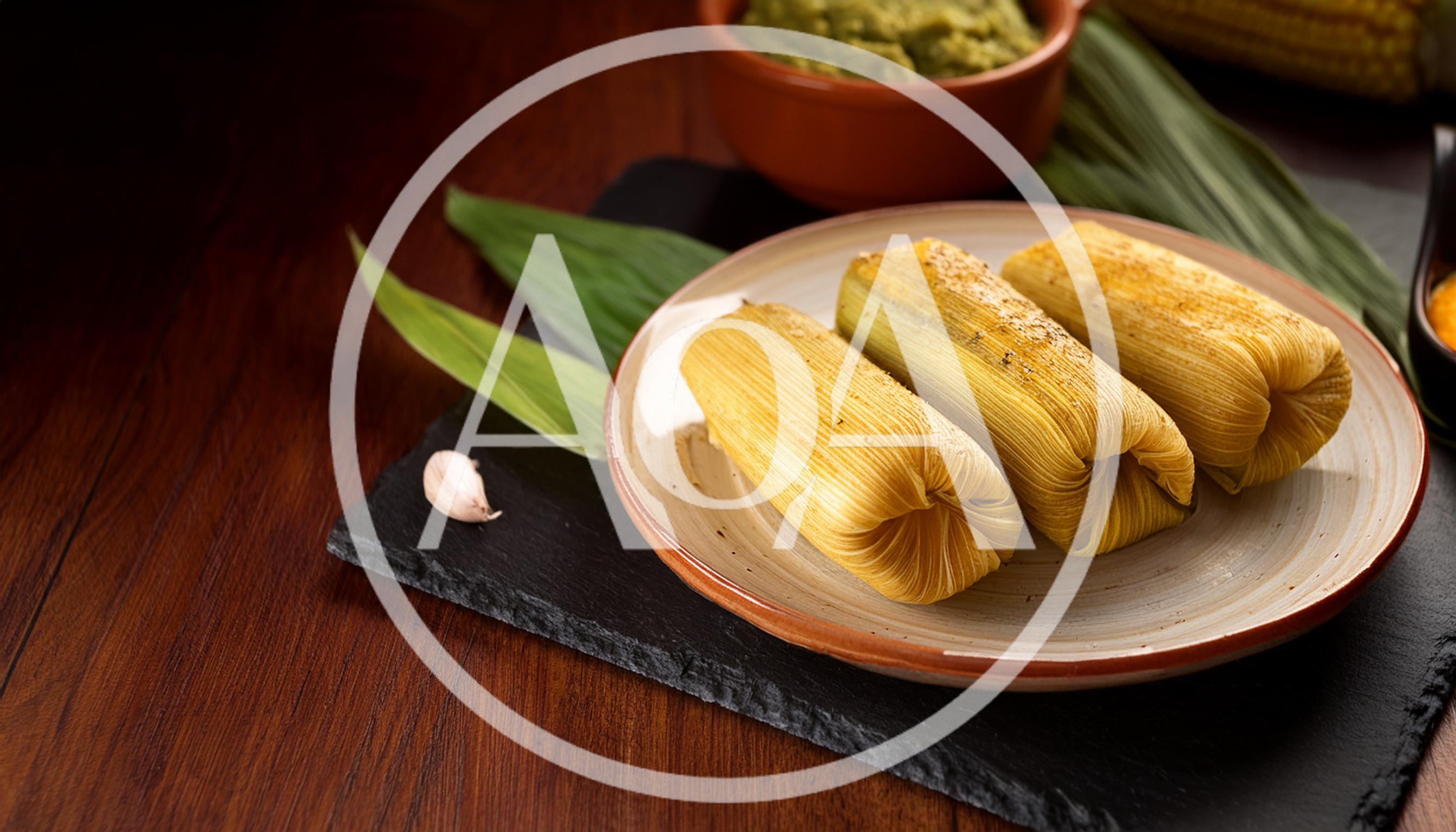 Three Traditional Corn Tamales Served on a Plate