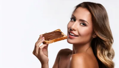 Beautiful Woman Eating Chocolate Spread On Toast