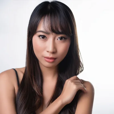 Portrait Of A Young Asian Woman With Long Hair