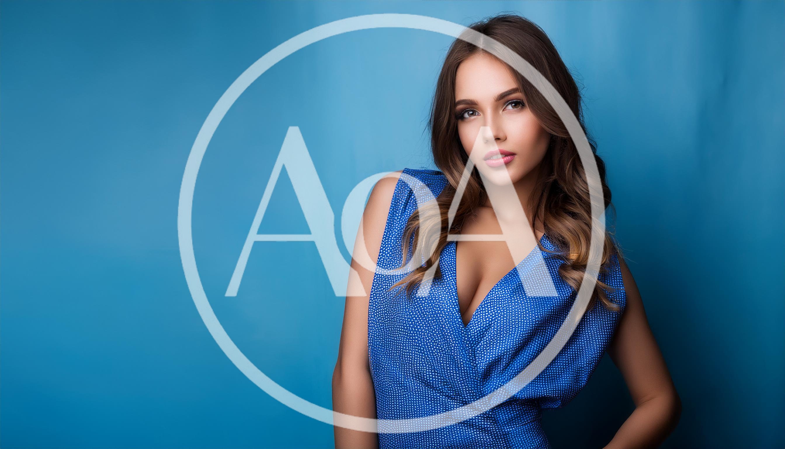Portrait Of A Beautiful Young Woman In Blue Dress