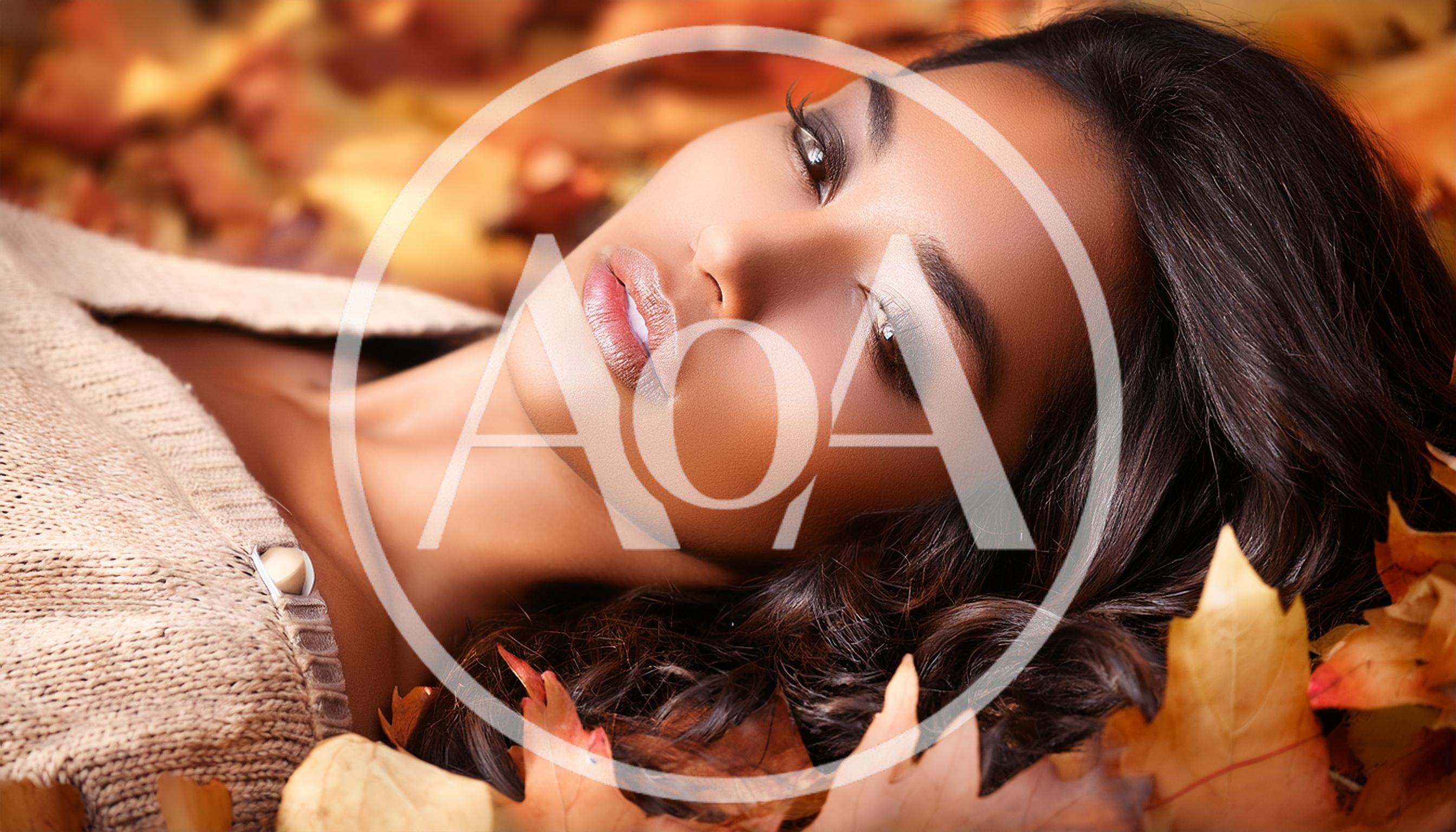Beautiful Woman Relaxing In Autumn Leaves