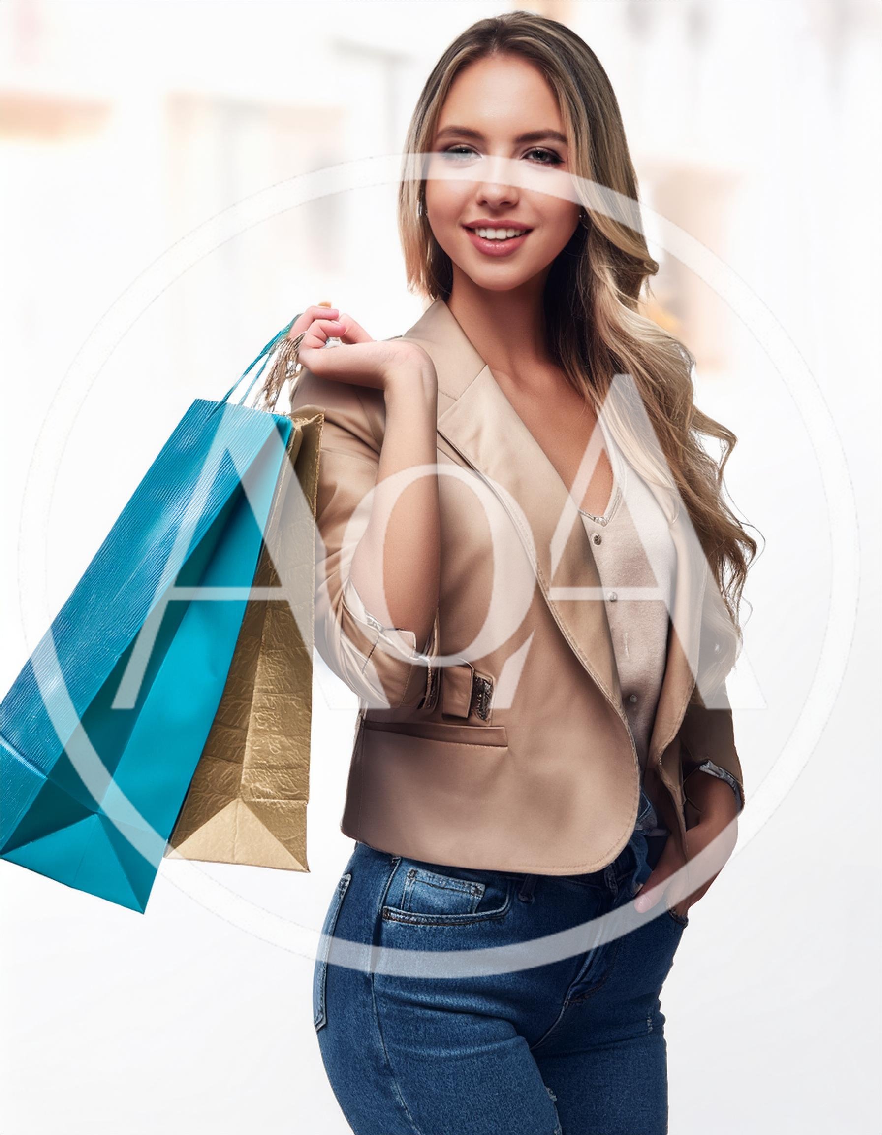Young Woman Carrying Shopping Bags After A Day Out