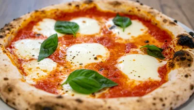 Freshly Baked Neapolitan Margherita Pizza With Basil