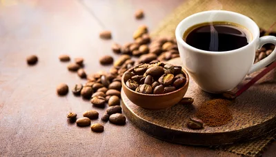 Cup Of Hot Coffee With Roasted Coffee Beans