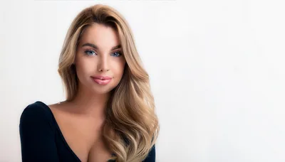 Portrait Of A Beautiful Blonde Woman With Blue Eyes