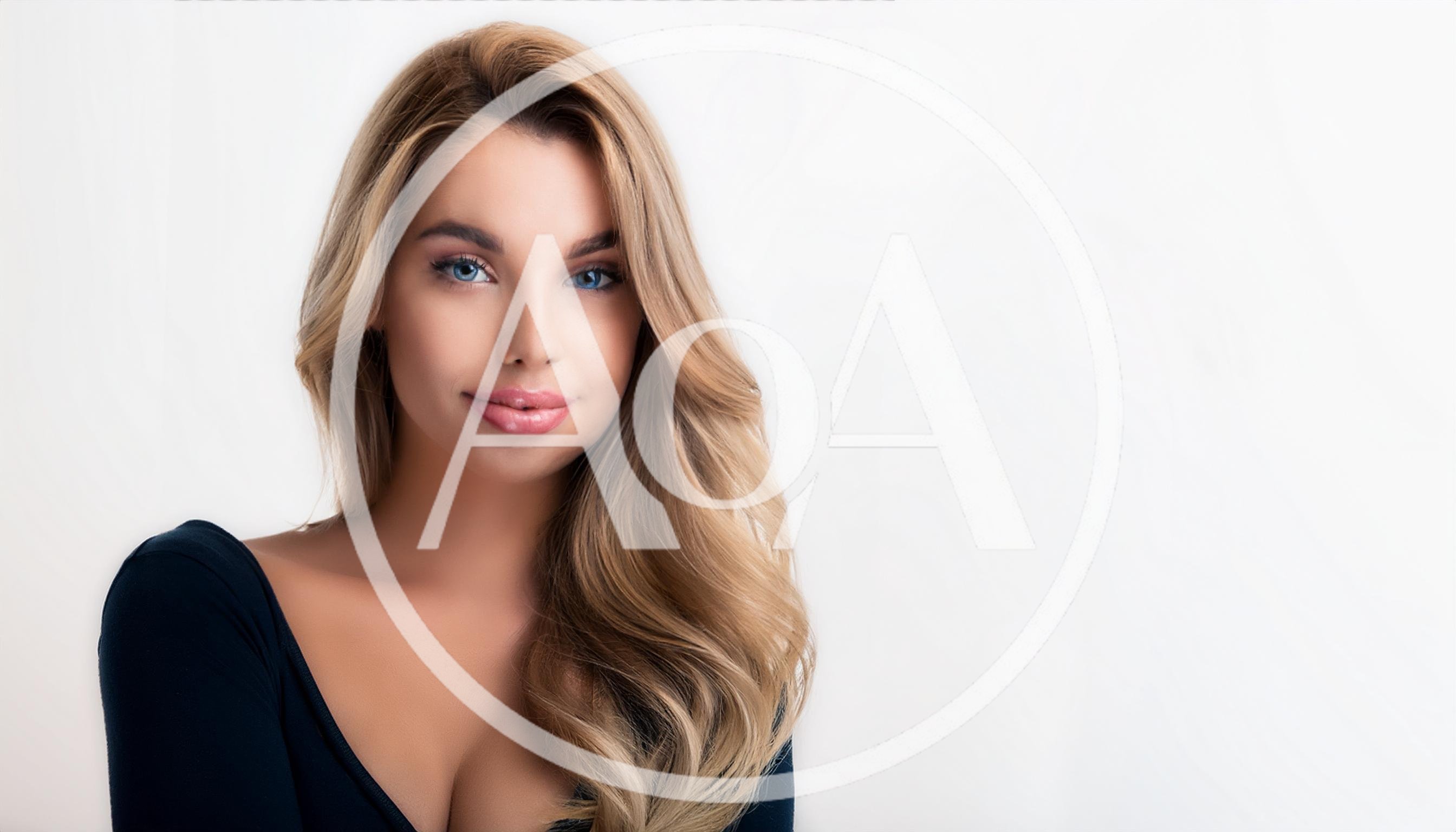 Portrait Of A Beautiful Blonde Woman With Blue Eyes
