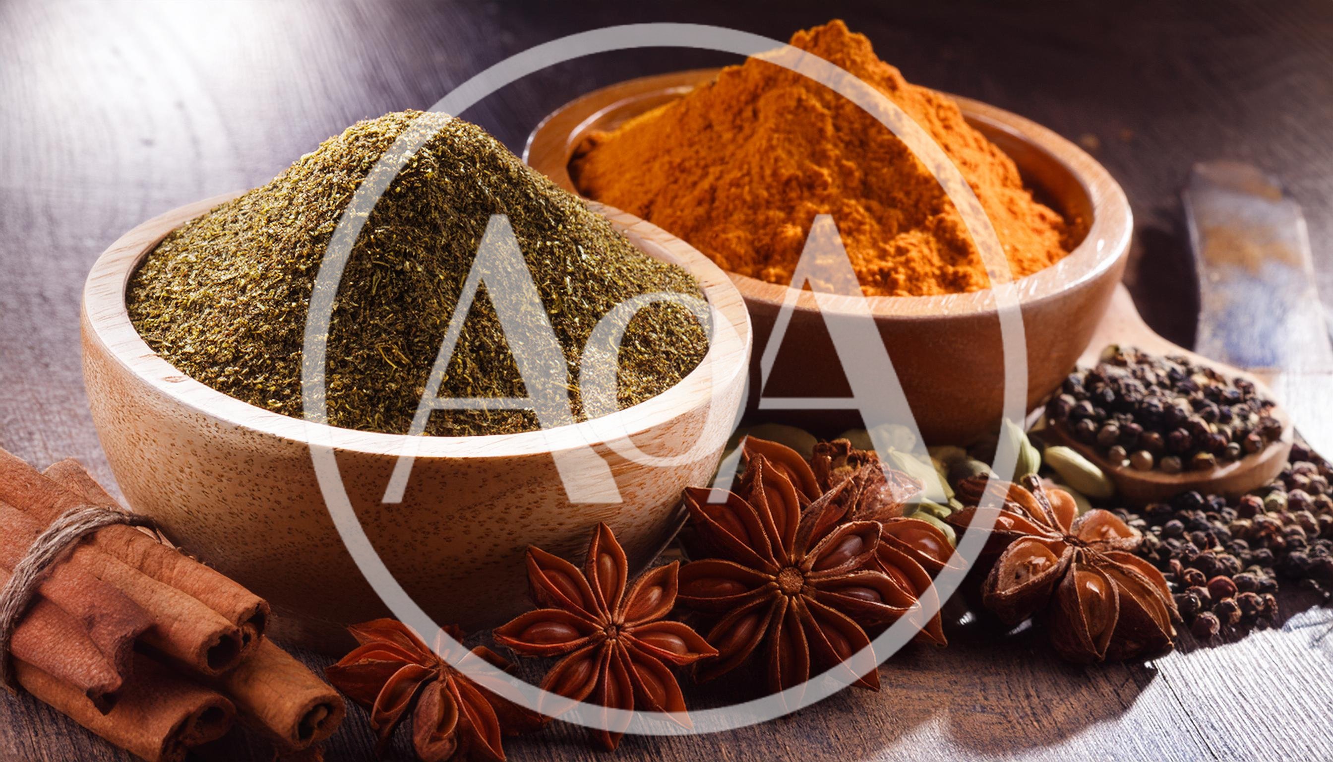 Assorted Spices And Herbs In Wooden Bowls