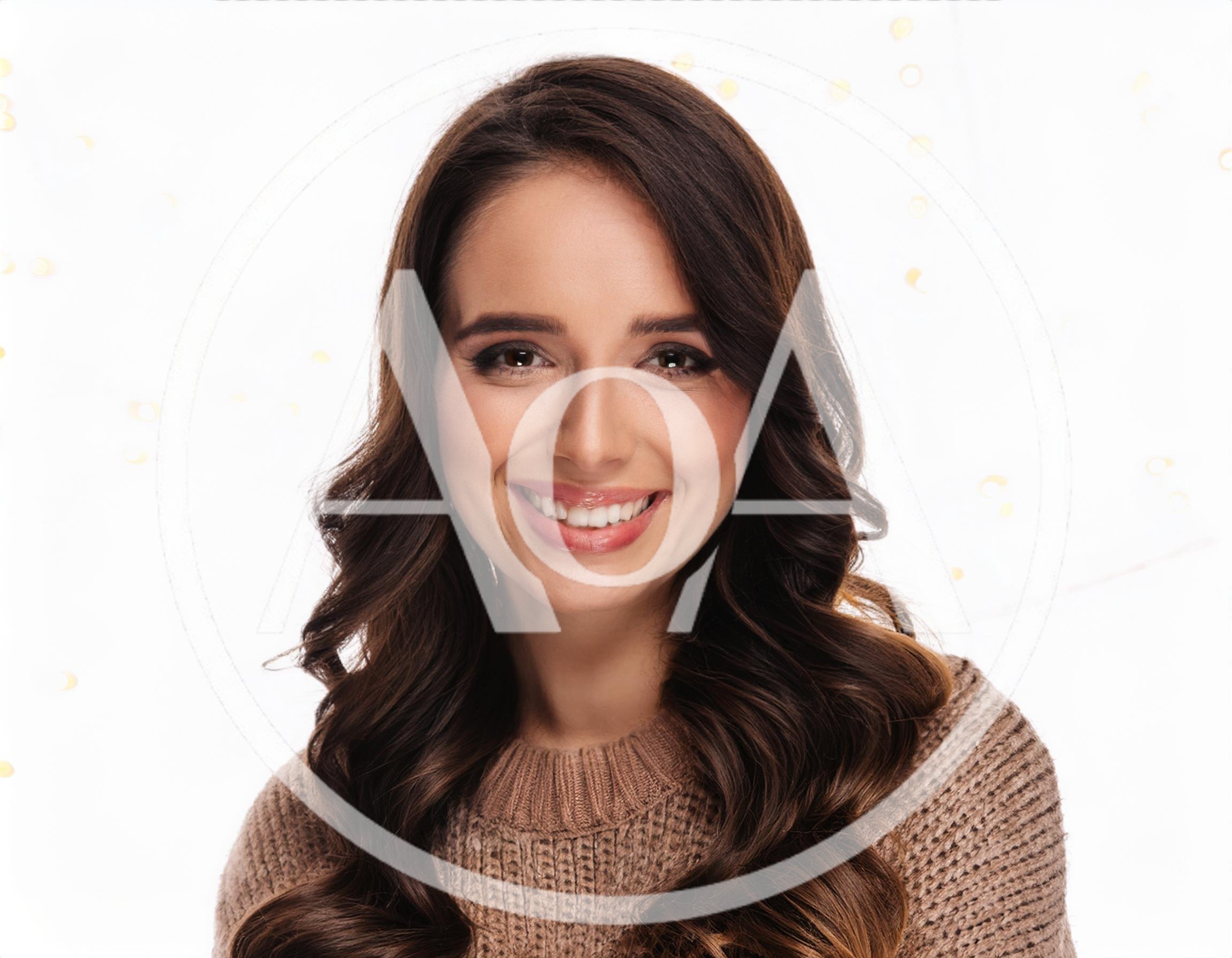 Portrait Of A Smiling Young Woman With Wavy Hair