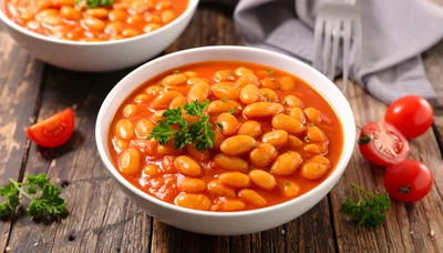 Two Bowls Of Baked Beans In Tomato Sauce