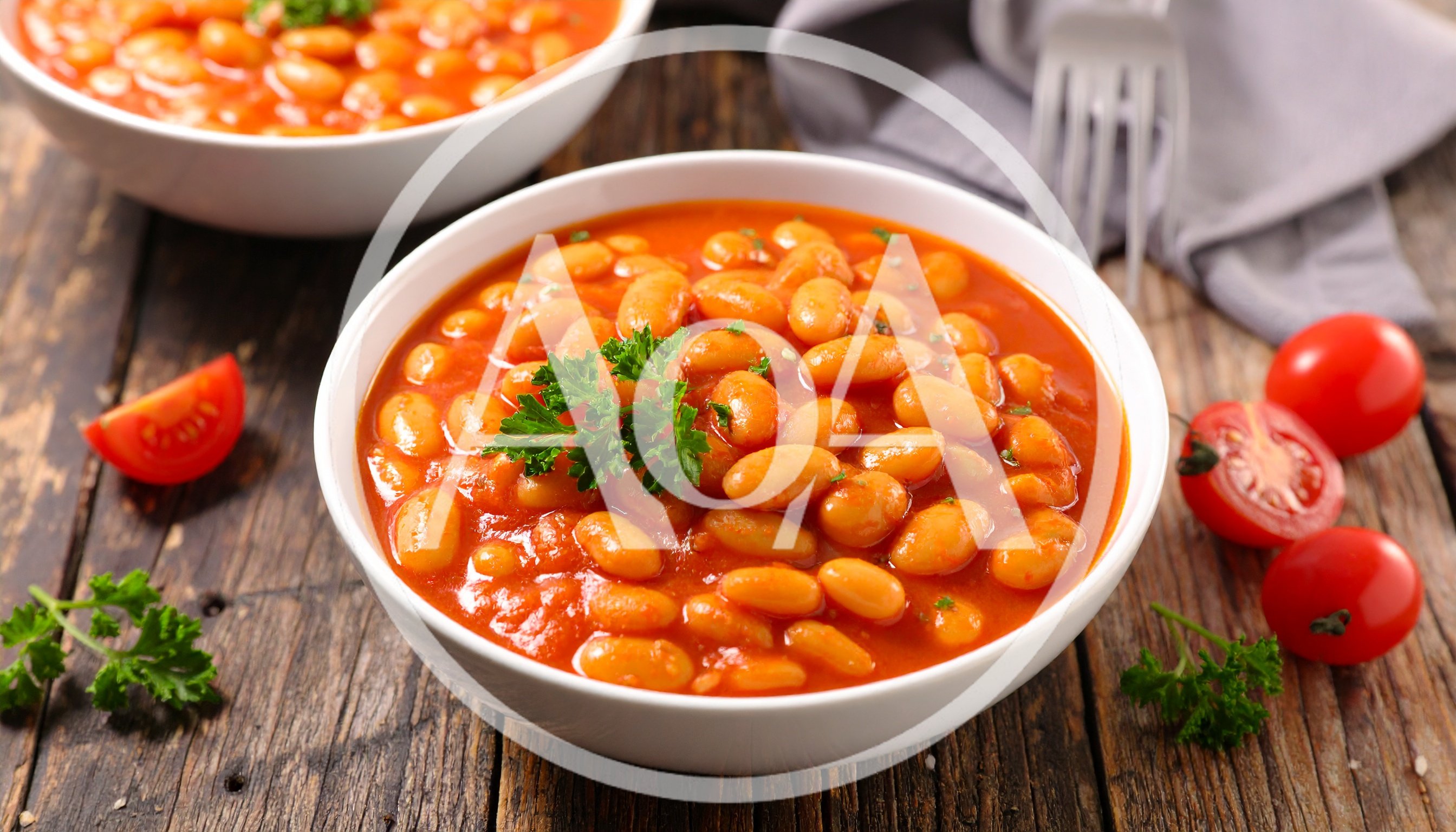 Two Bowls Of Baked Beans In Tomato Sauce