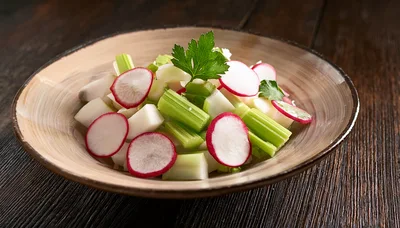 Fresh Radish and Celery Salad in Ceramic Bowl