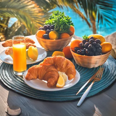 Breakfast Table With Croissants And Fruit By The Pool