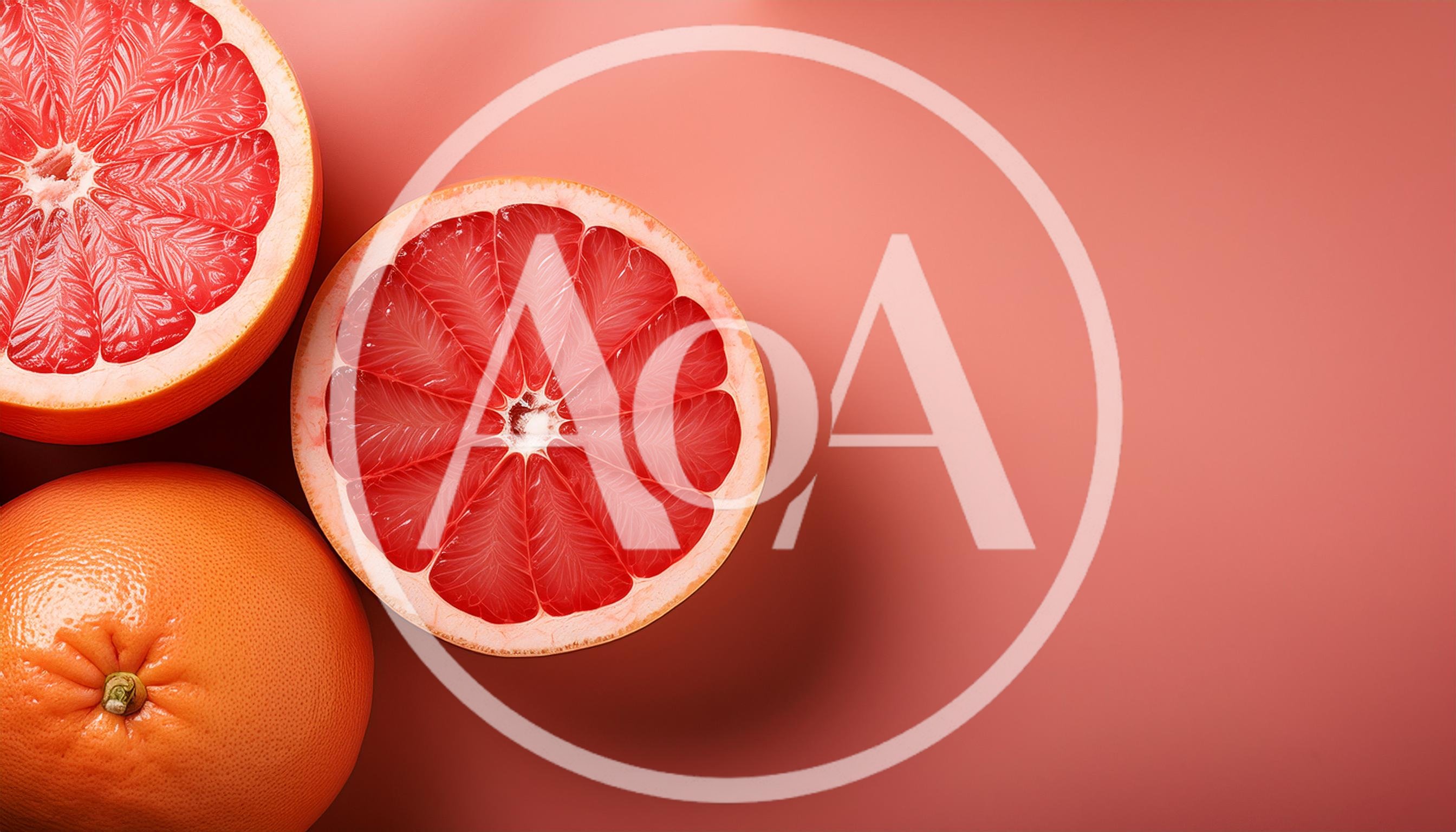 Fresh Grapefruit Halves and Whole Fruit on Pink Background