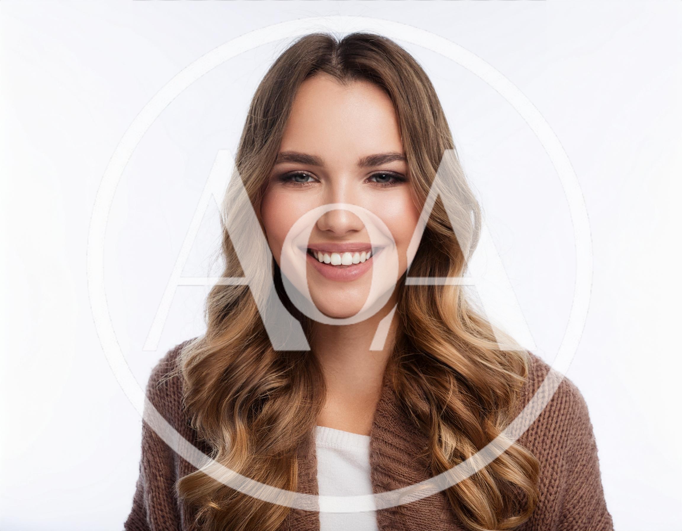 Portrait Of A Smiling Young Woman With Wavy Hair