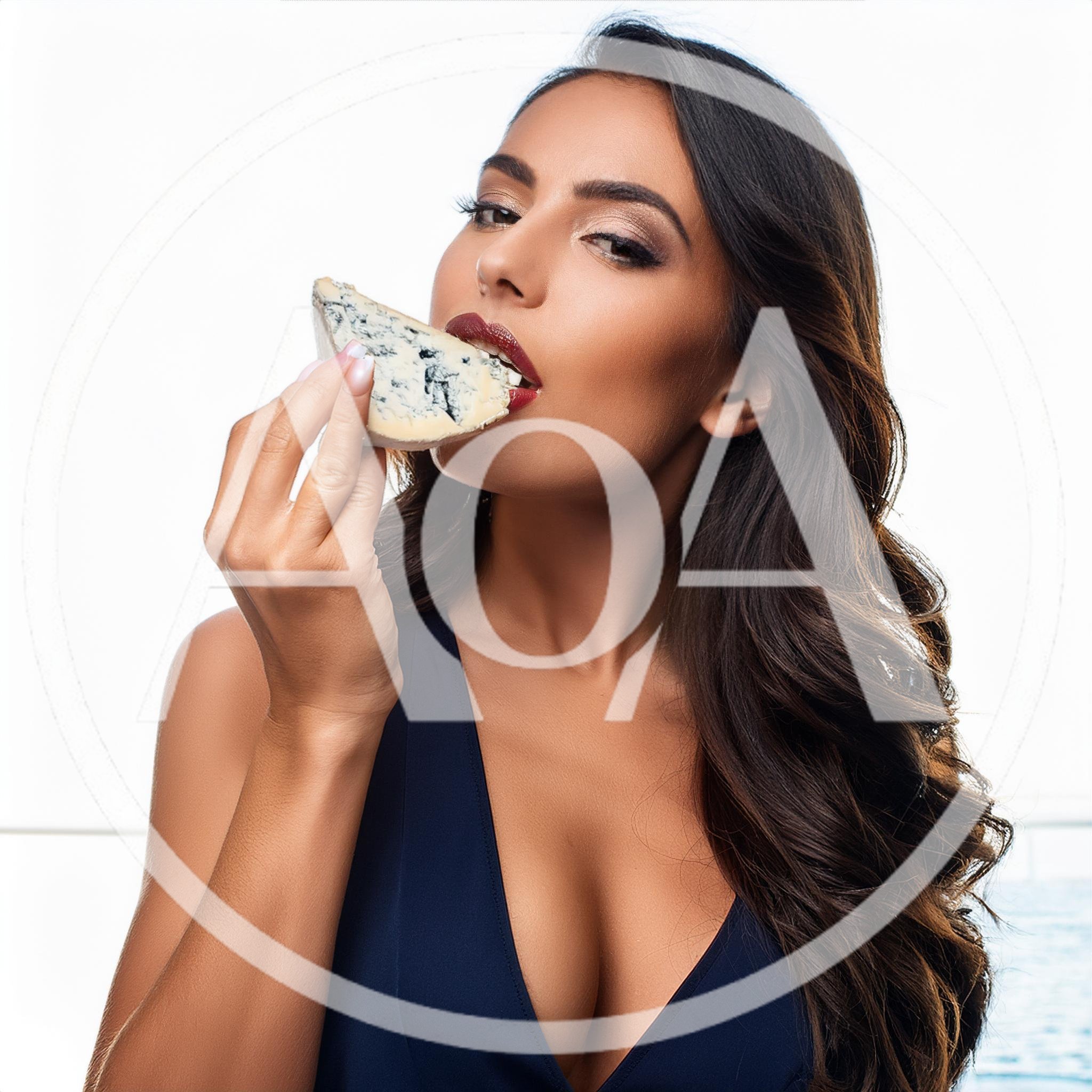 Beautiful Woman Eating A Slice Of Blue Cheese