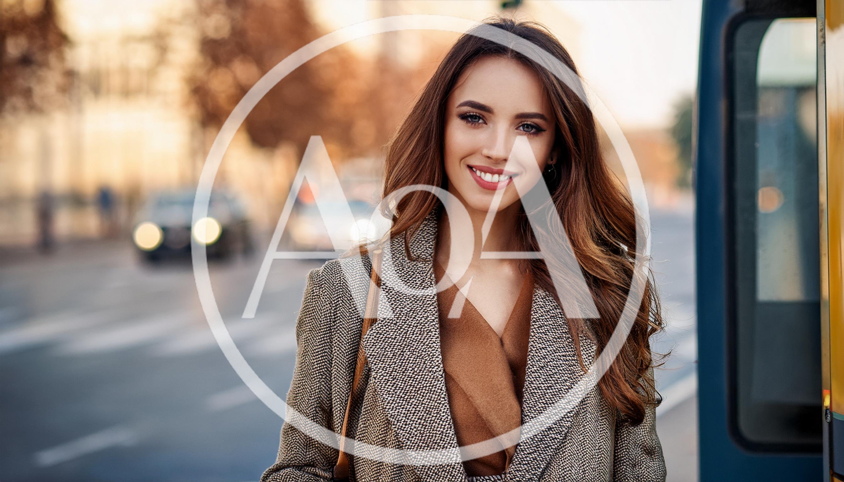 Smiling Young Woman Standing Near A City Street