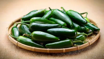 Fresh Green Jalapeno Peppers In A Woven Basket