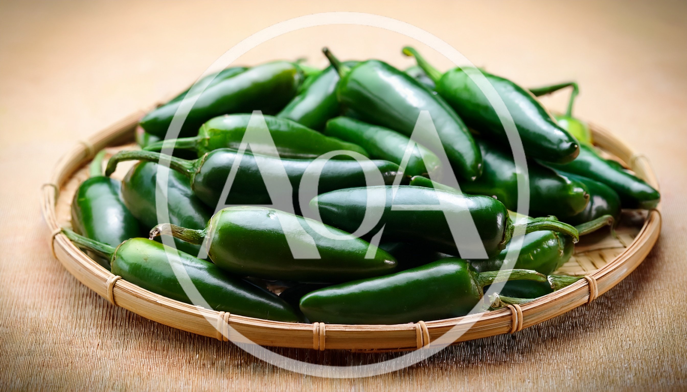 Fresh Green Jalapeno Peppers In A Woven Basket