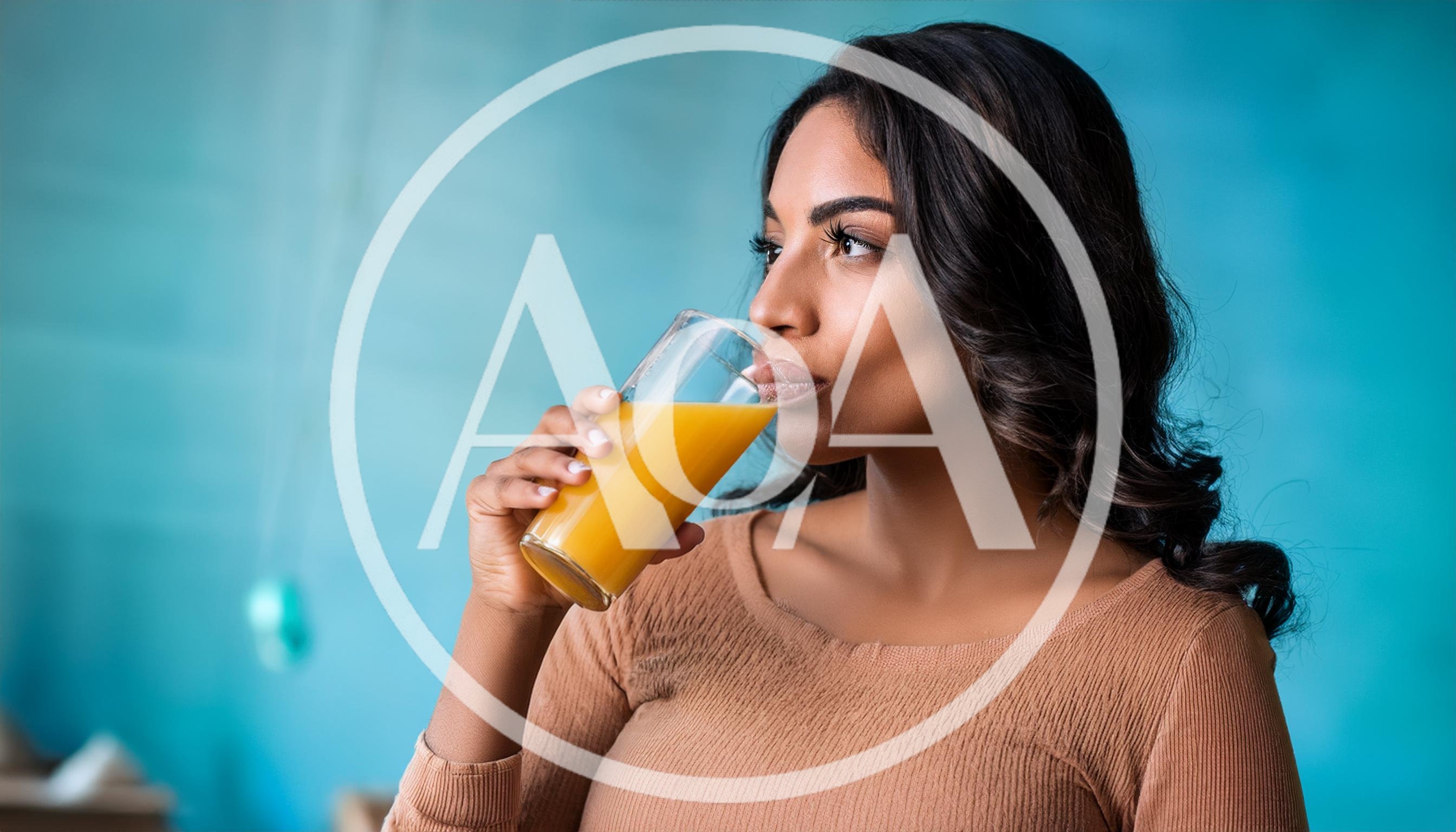 Young Woman Drinking Fresh Orange Juice