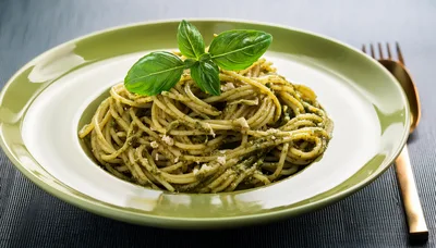 Spaghetti Pasta With Pesto Sauce On Green Plate