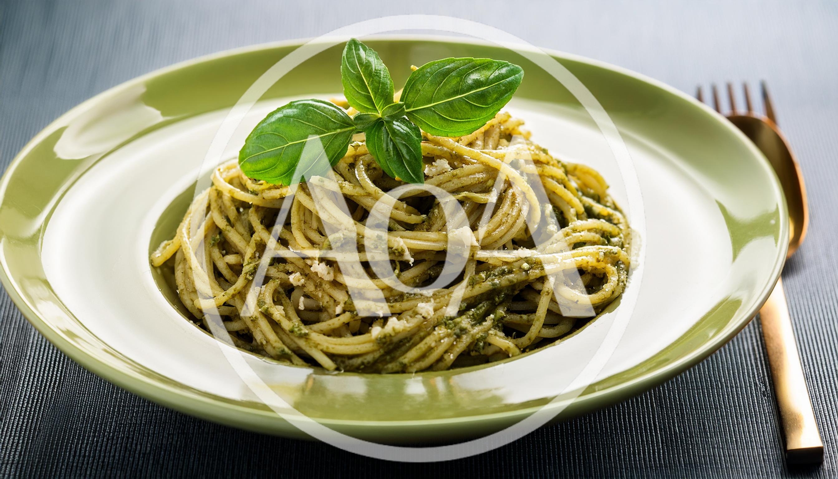 Spaghetti Pasta With Pesto Sauce On Green Plate