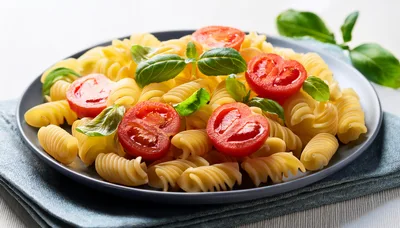 Fusilli Pasta With Fresh Tomatoes And Basil Leaves