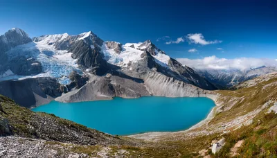 Stunning Turquoise Glacial Lake Beneath Snow Capped Mountains