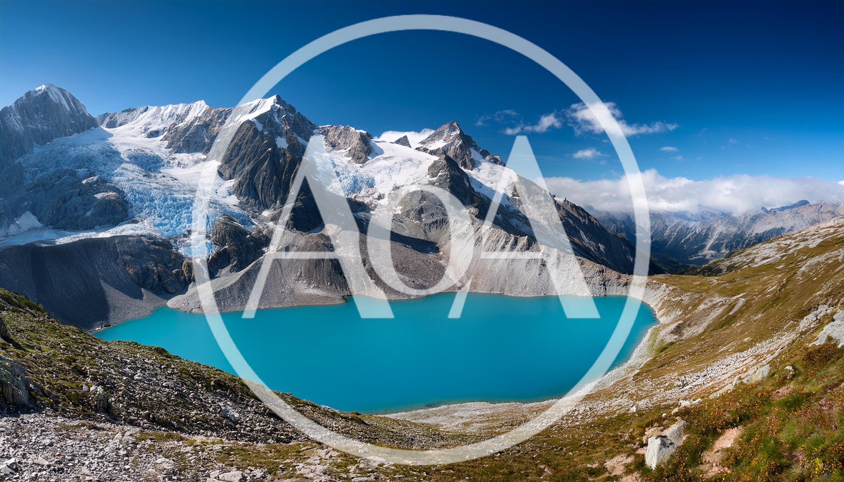 Stunning Turquoise Glacial Lake Beneath Snow Capped Mountains