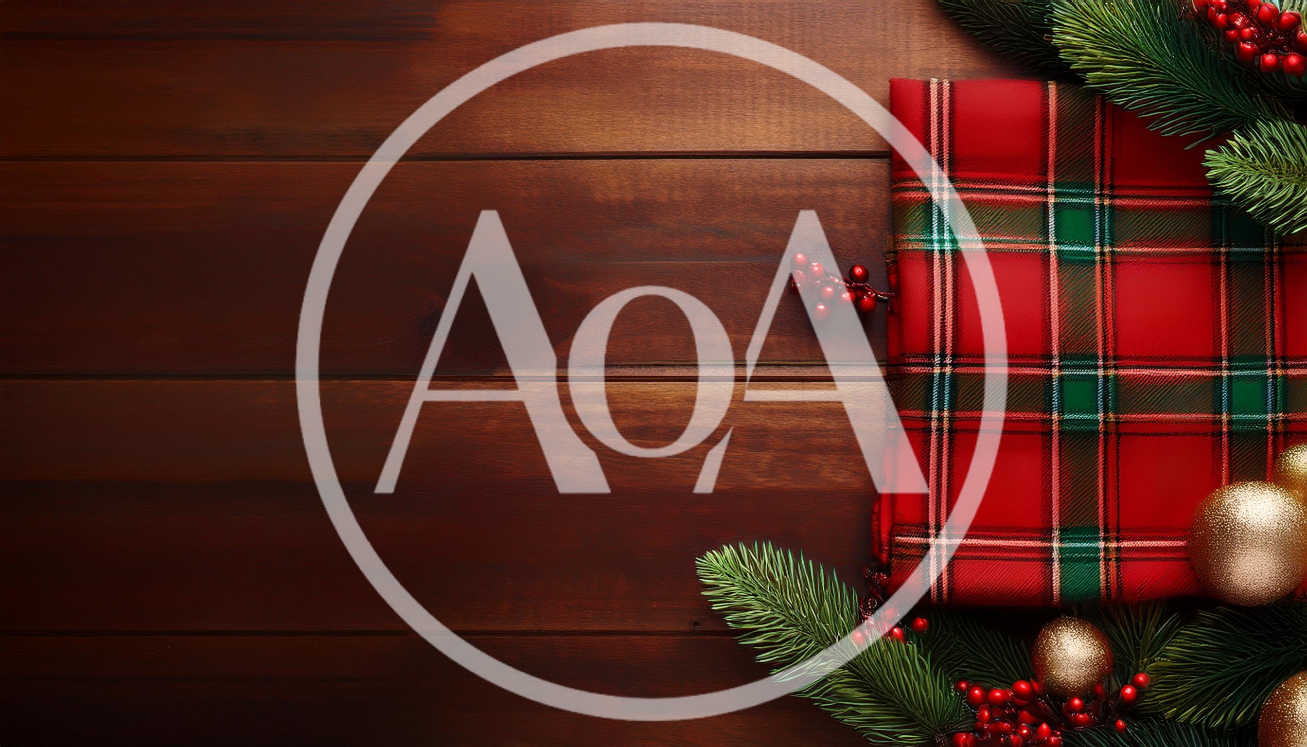 Christmas Gift Wrapped In Plaid Fabric On Wooden Background