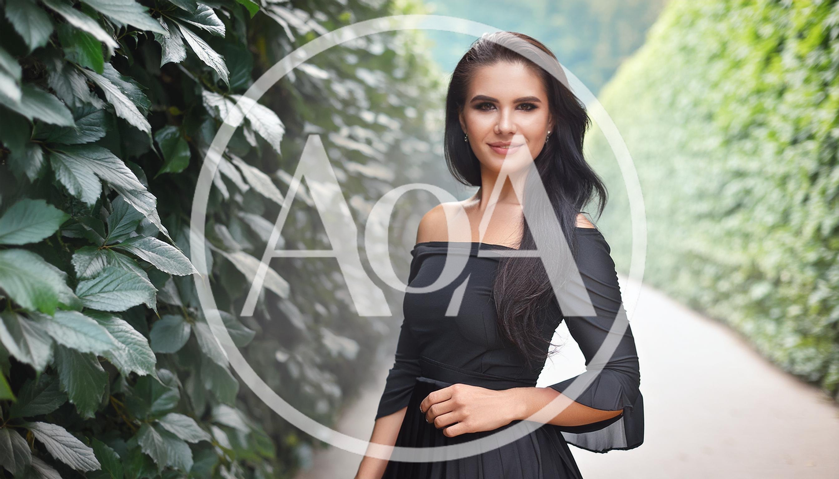 Elegant Woman Posing In A Lush Green Garden Path