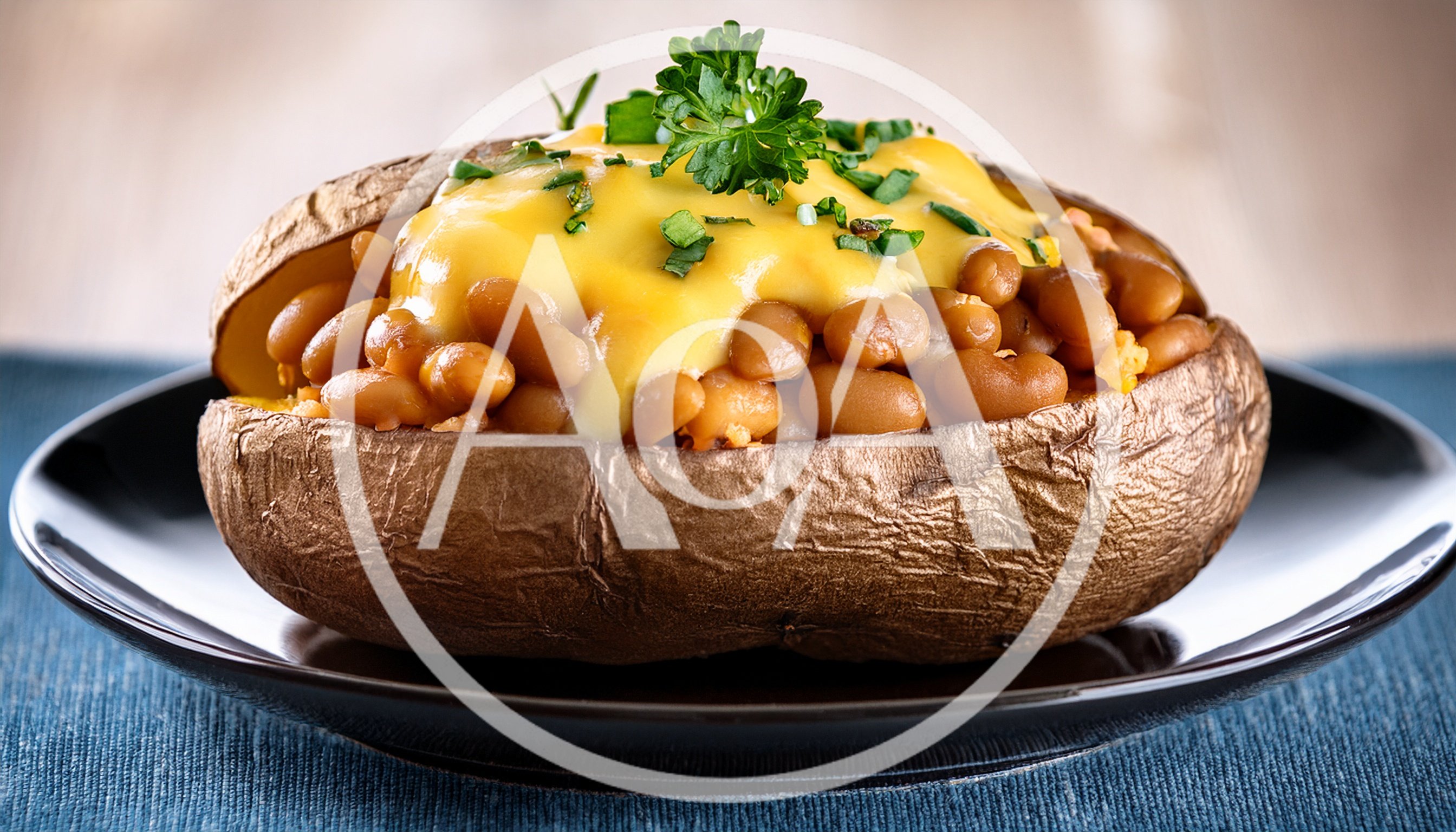 Baked Potato Topped With Beans And Melted Cheese
