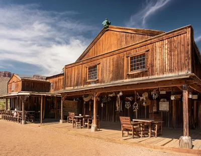 Rustic Wooden Western Saloon Building In Desert Landscape