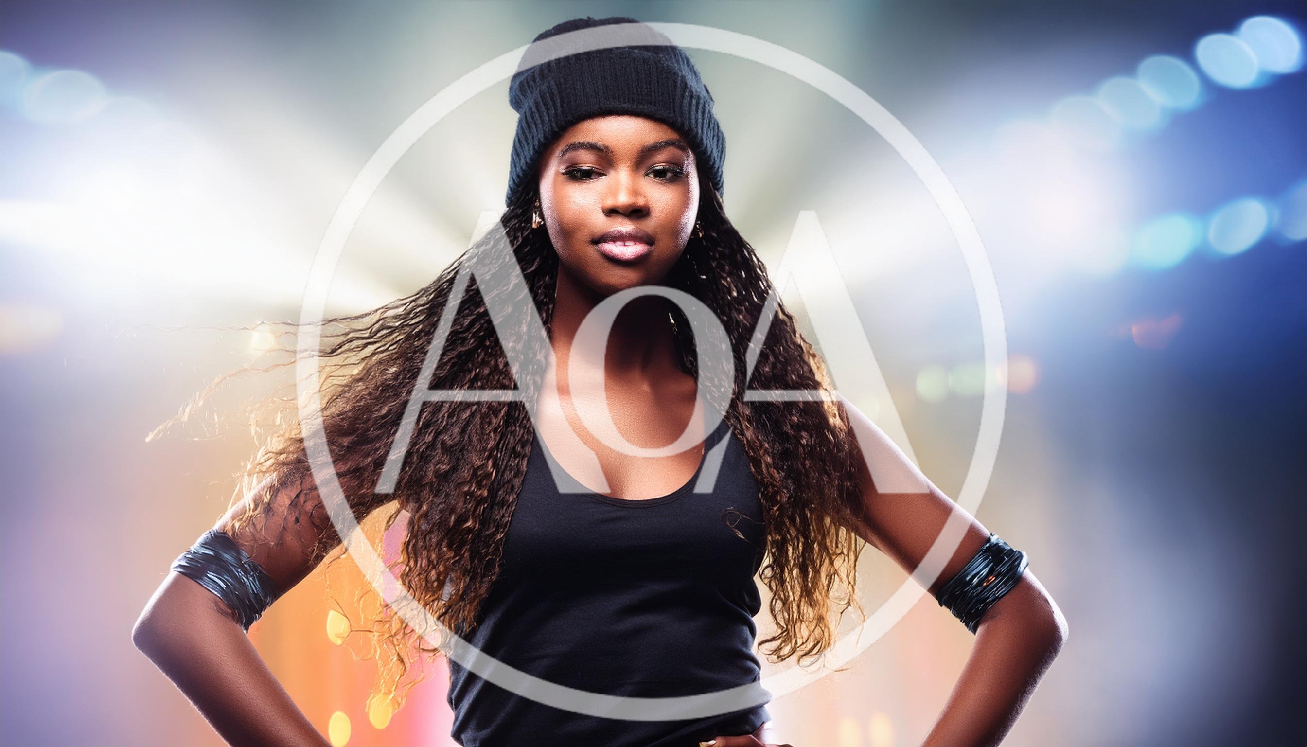 Young Woman Wearing Beanie Posing On Stage