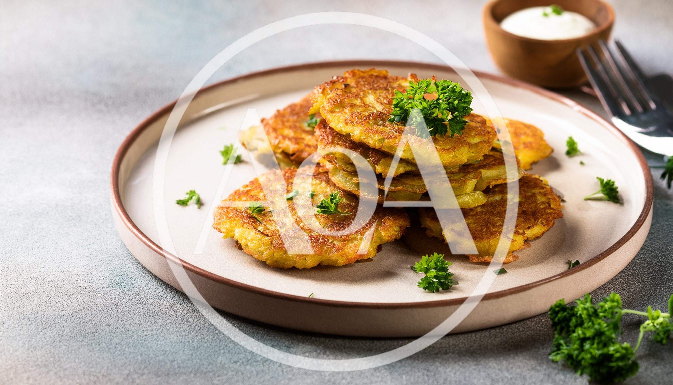 Crispy Potato Pancakes Served On A Ceramic Plate