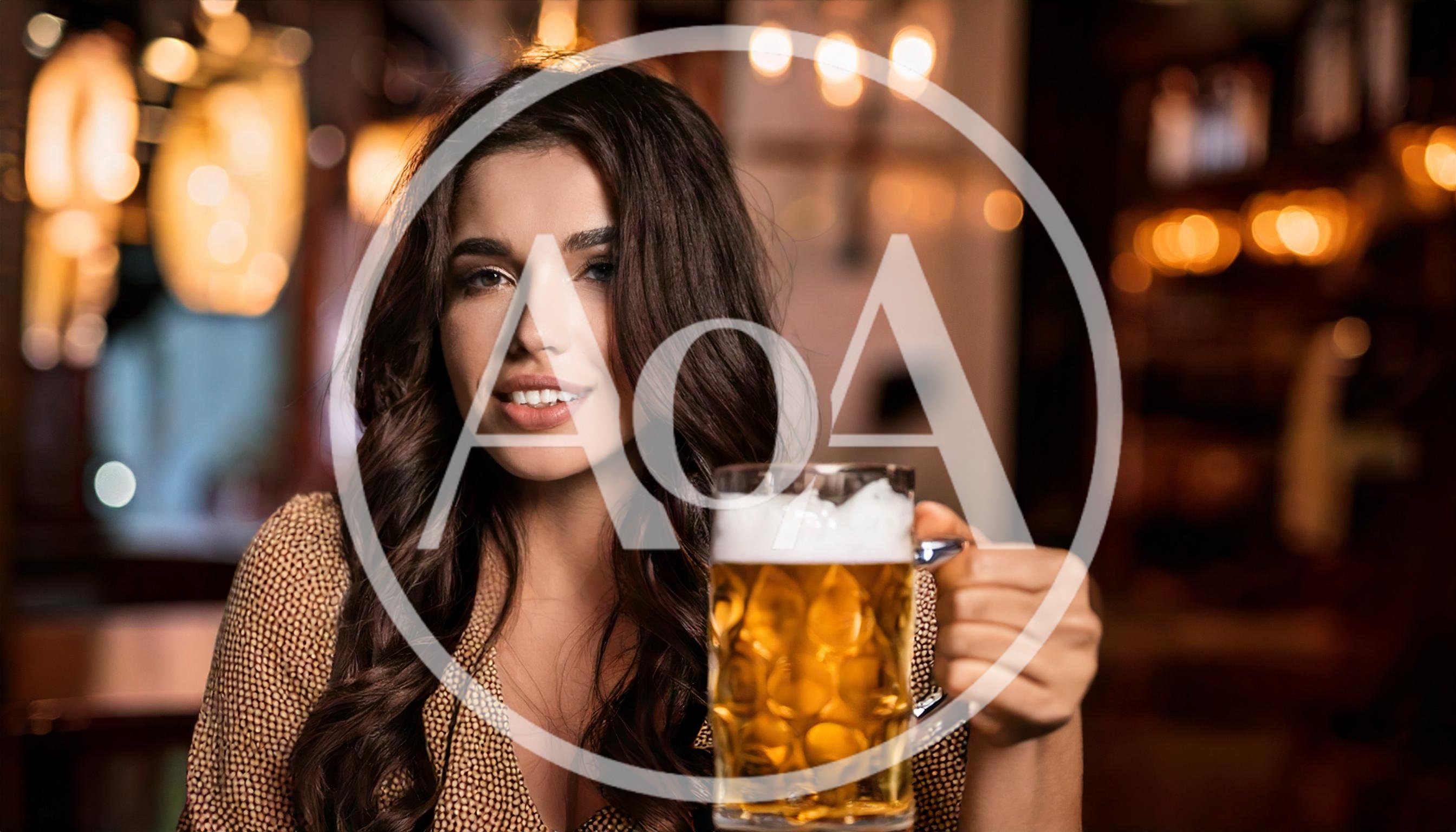 Young Woman Holding A Beer Mug In A Pub