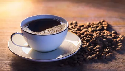 Cup Of Hot Coffee With Roasted Beans
