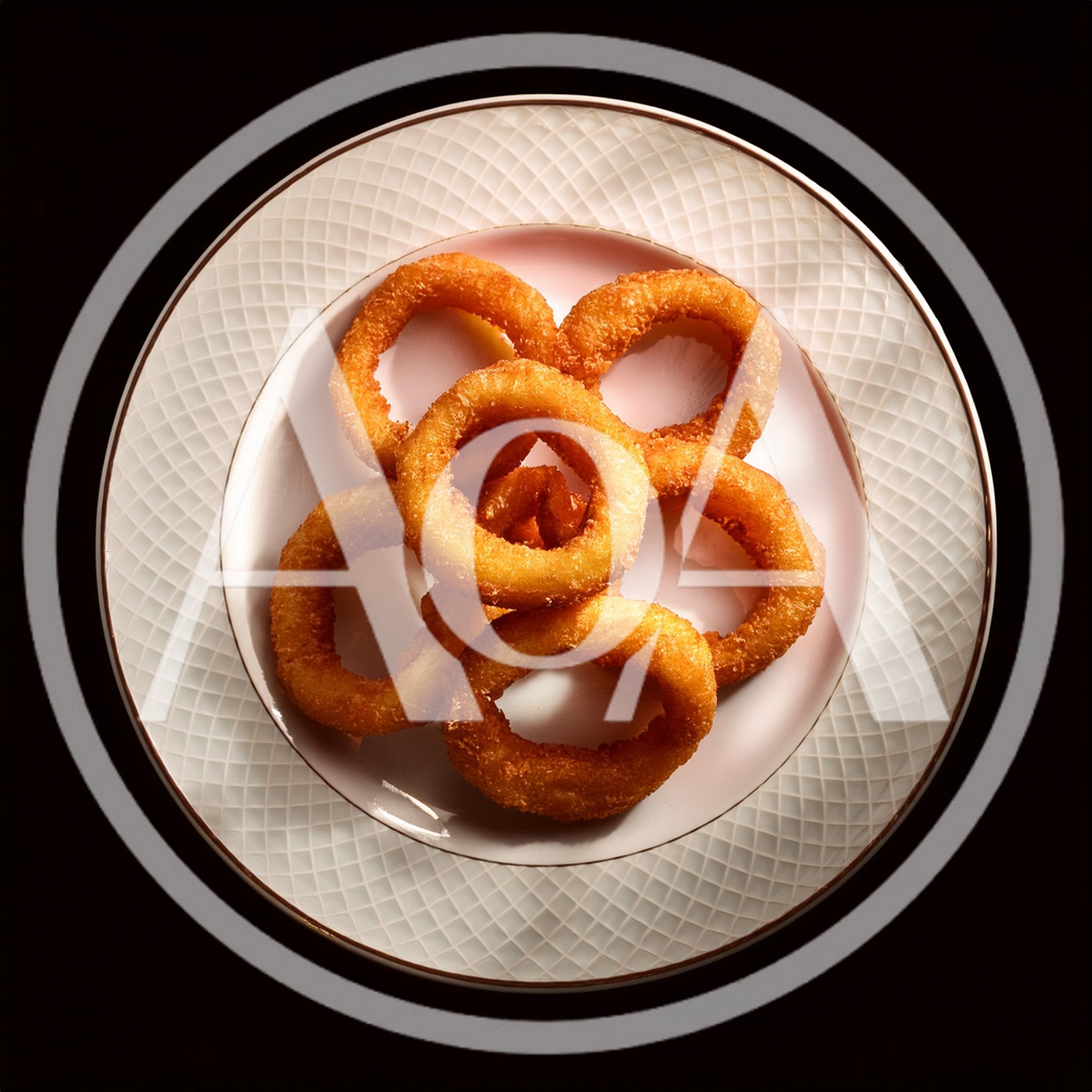 Crispy Golden Fried Onion Rings on a Decorative Plate