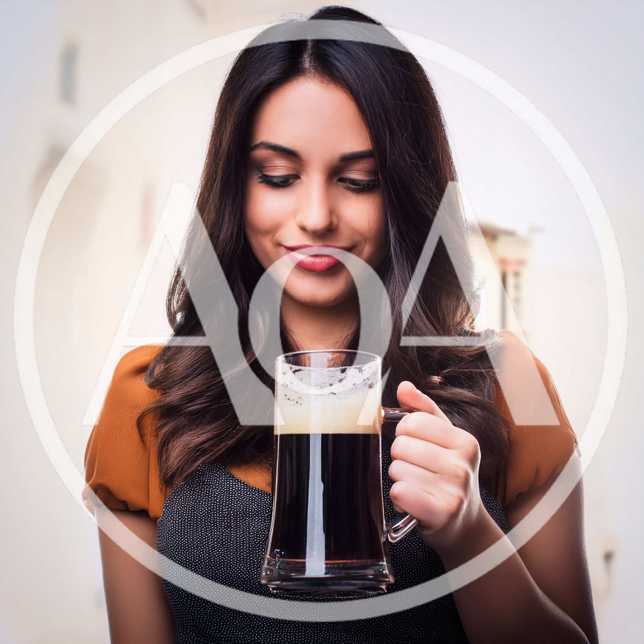 Young Woman Holding A Glass Of Dark Beer
