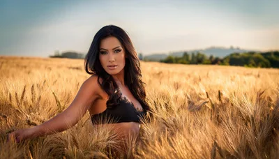 Beautiful Woman Posing In A Golden Wheat Field