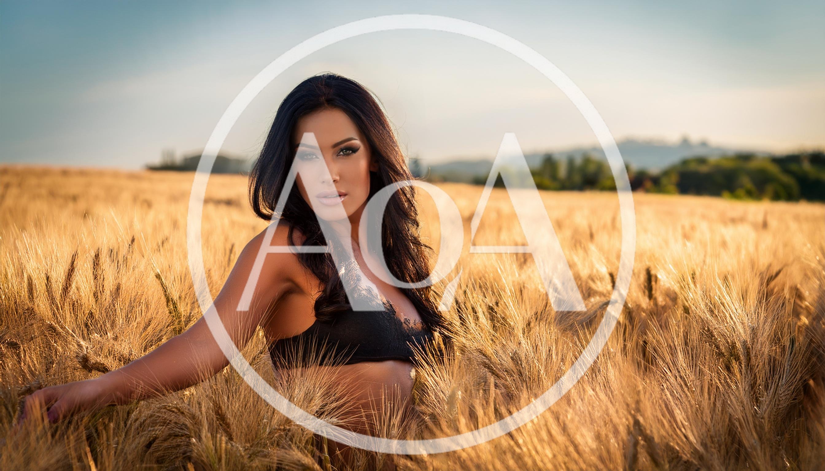 Beautiful Woman Posing In A Golden Wheat Field