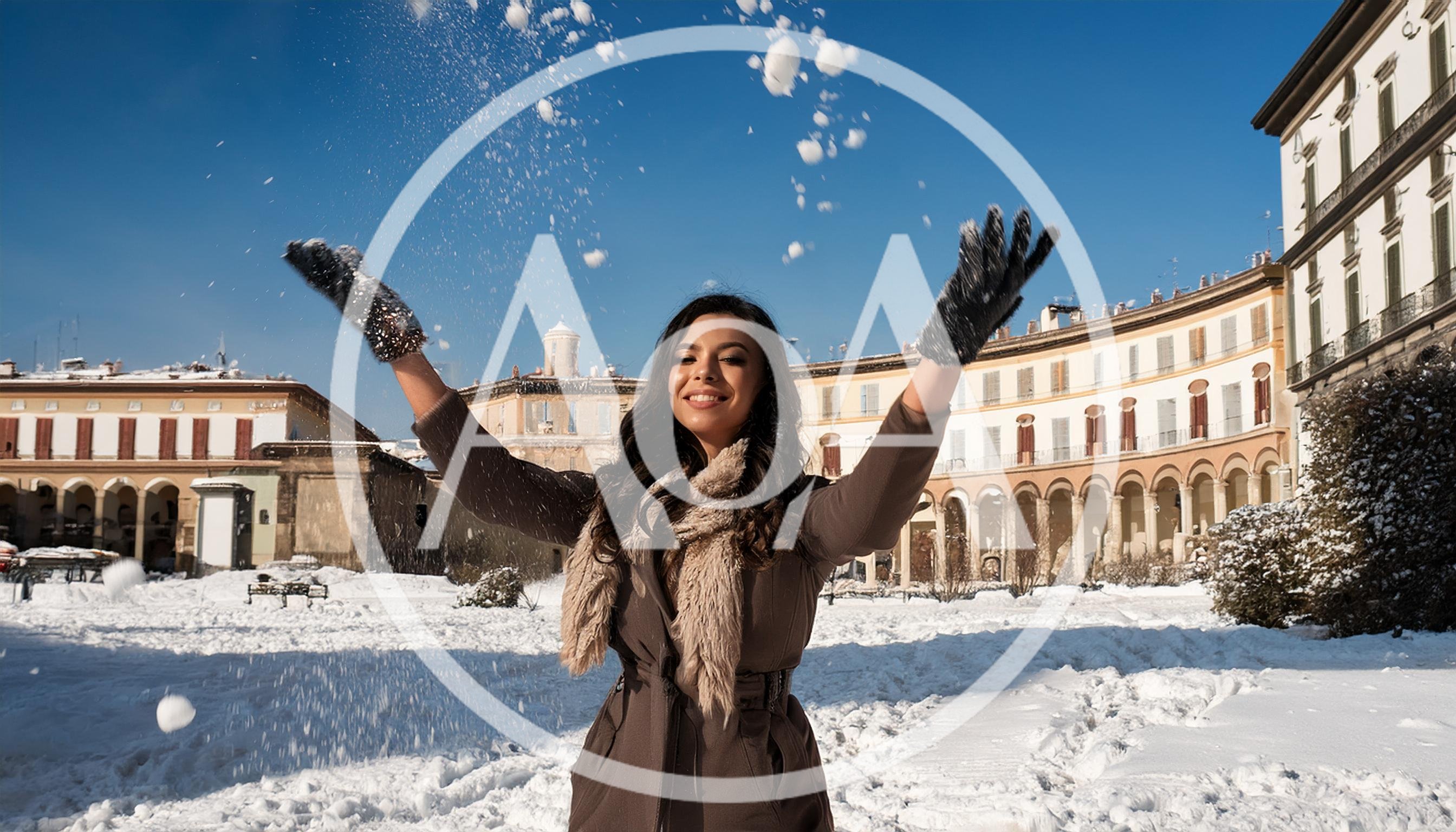 Young Woman Throwing Snow in a Historic Italian Square