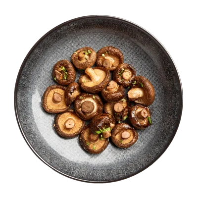 Top View Of Roasted Shiitake Mushrooms On A Plate