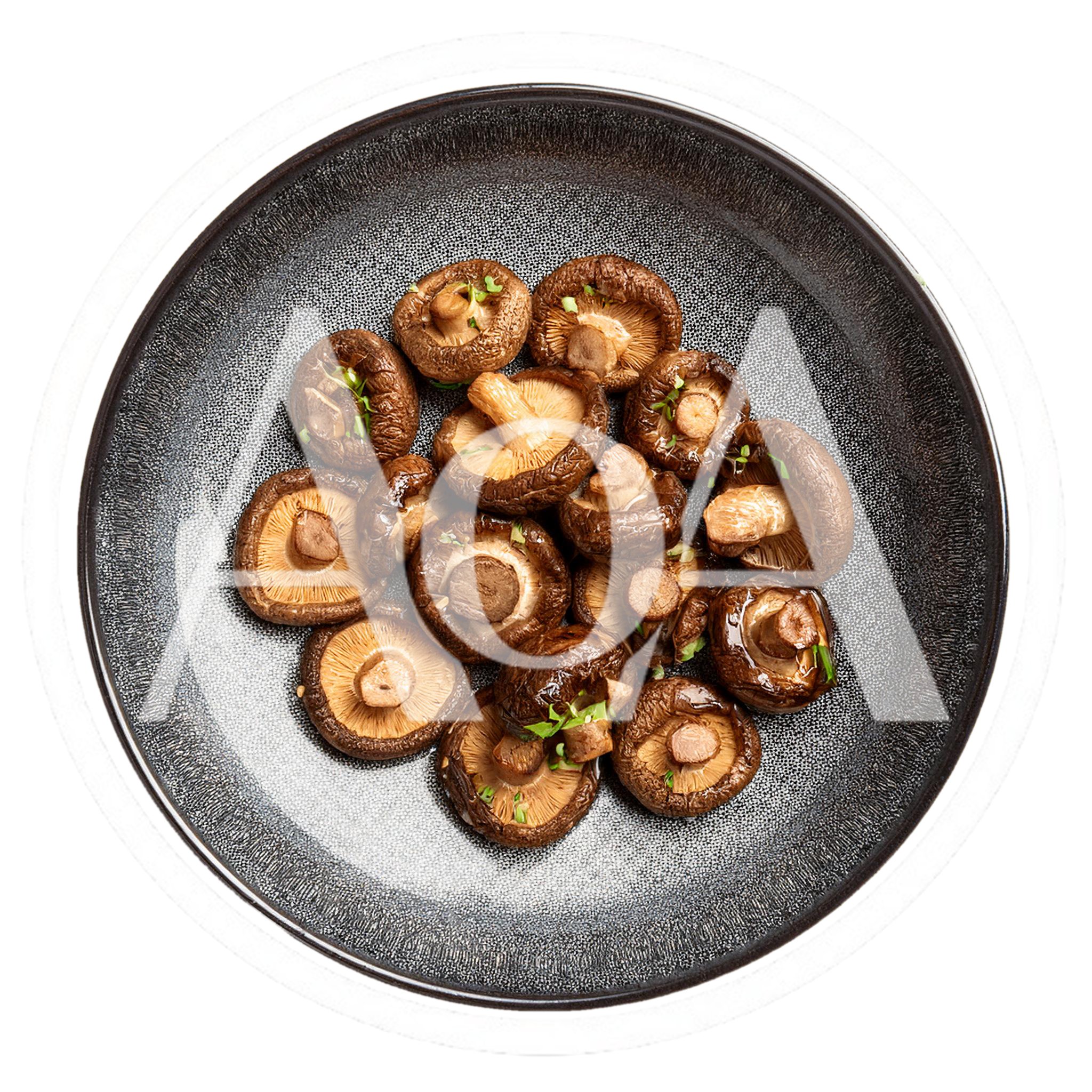 Top View Of Roasted Shiitake Mushrooms On A Plate