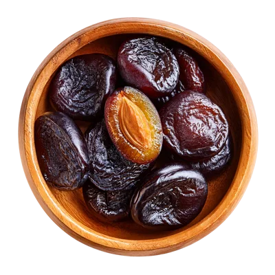 Dried Plums In A Wooden Bowl