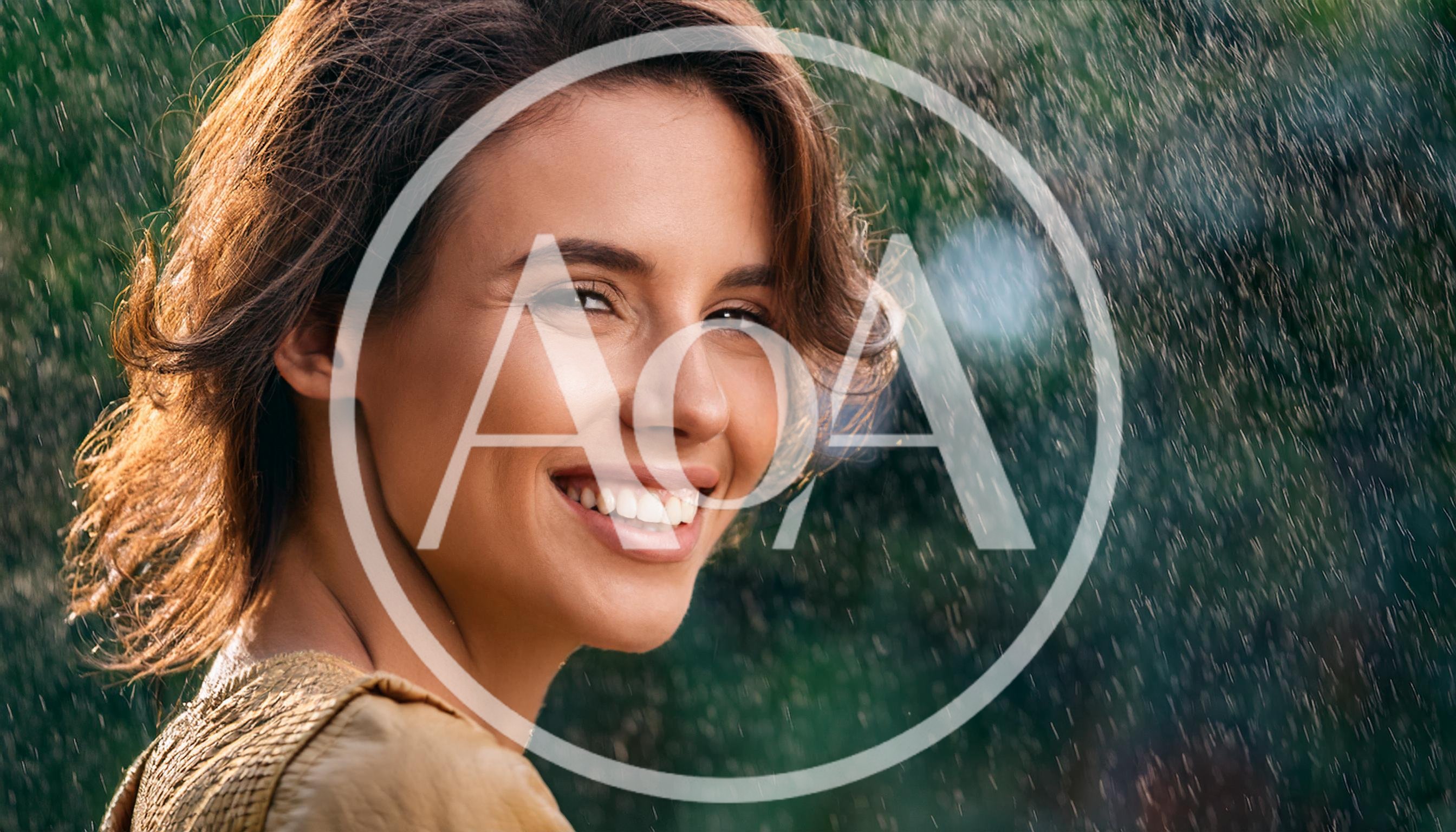 Smiling Woman Enjoying Refreshing Rain Outdoors