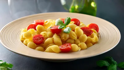Bowl Of Conchiglie Pasta With Cherry Tomatoes And Basil