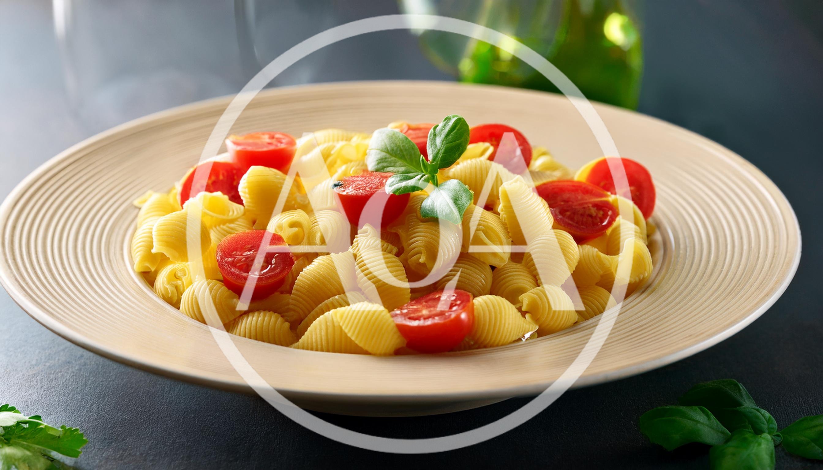Bowl Of Conchiglie Pasta With Cherry Tomatoes And Basil