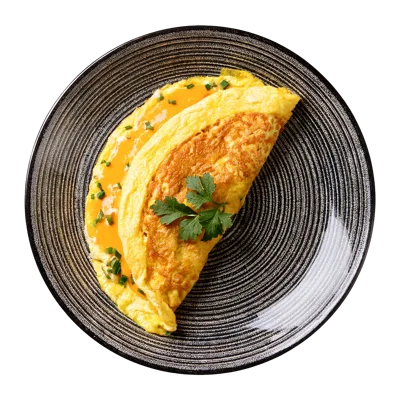 Freshly Cooked Omelet With Herbs On A Plate
