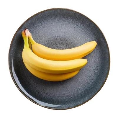 Three Fresh Yellow Bananas On A Textured Plate