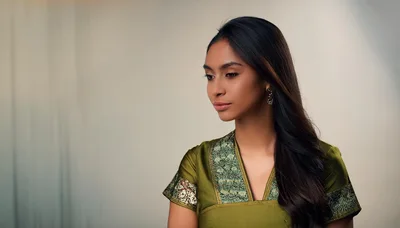 Portrait Of A Young Woman In Traditional Green Attire
